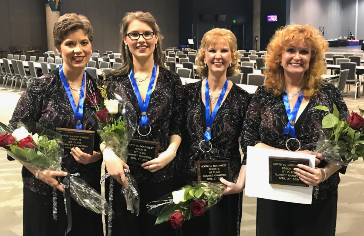 Barbershop quartet coached by Ted Chamberlain with competition awards